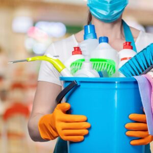 person holding cleaning supplies