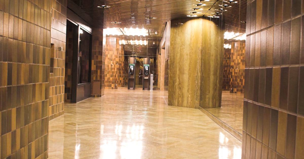 Brown mall alley with gleaming tile floors, creating a clean and inviting atmosphere for shoppers and families.